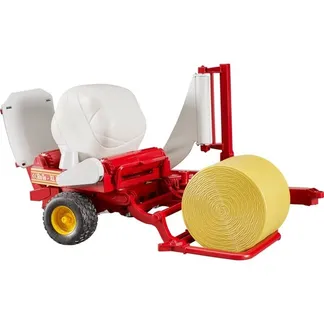 Ballenwickler mit ockerbraunem und schwarzem Rundballen, Modellfahrzeug Ballenwickler mit ockerbraunem und schwarzem Rundballen, Modellfahrzeug